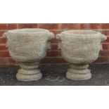 Pair of stoneware garden planters decorated with wild animals and birds amongst vines, 45cm high