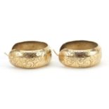 Pair of 9ct gold hoop earrings with engraved decoration, 2.7cm in diameter, 6.2g