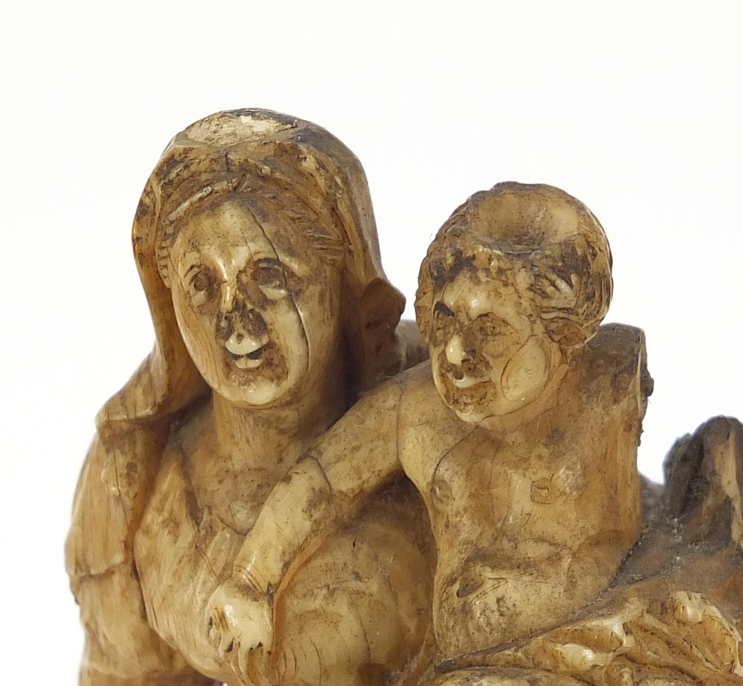 Antique ivory carving of Madonna and child raised on an ebonised and ivory base, 14cm high - Image 2 of 4