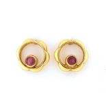 Pair of 9ct gold ruby stud earrings, 8mm in diameter, 1.2g