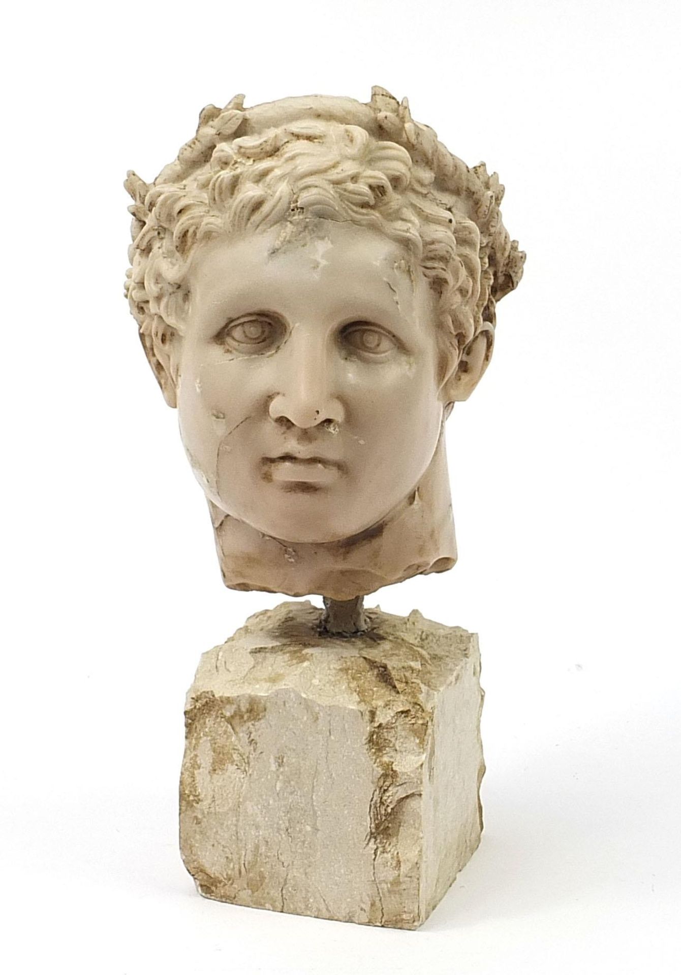 Roman style bust of a man, raised on a stone style base, 51.5cm high