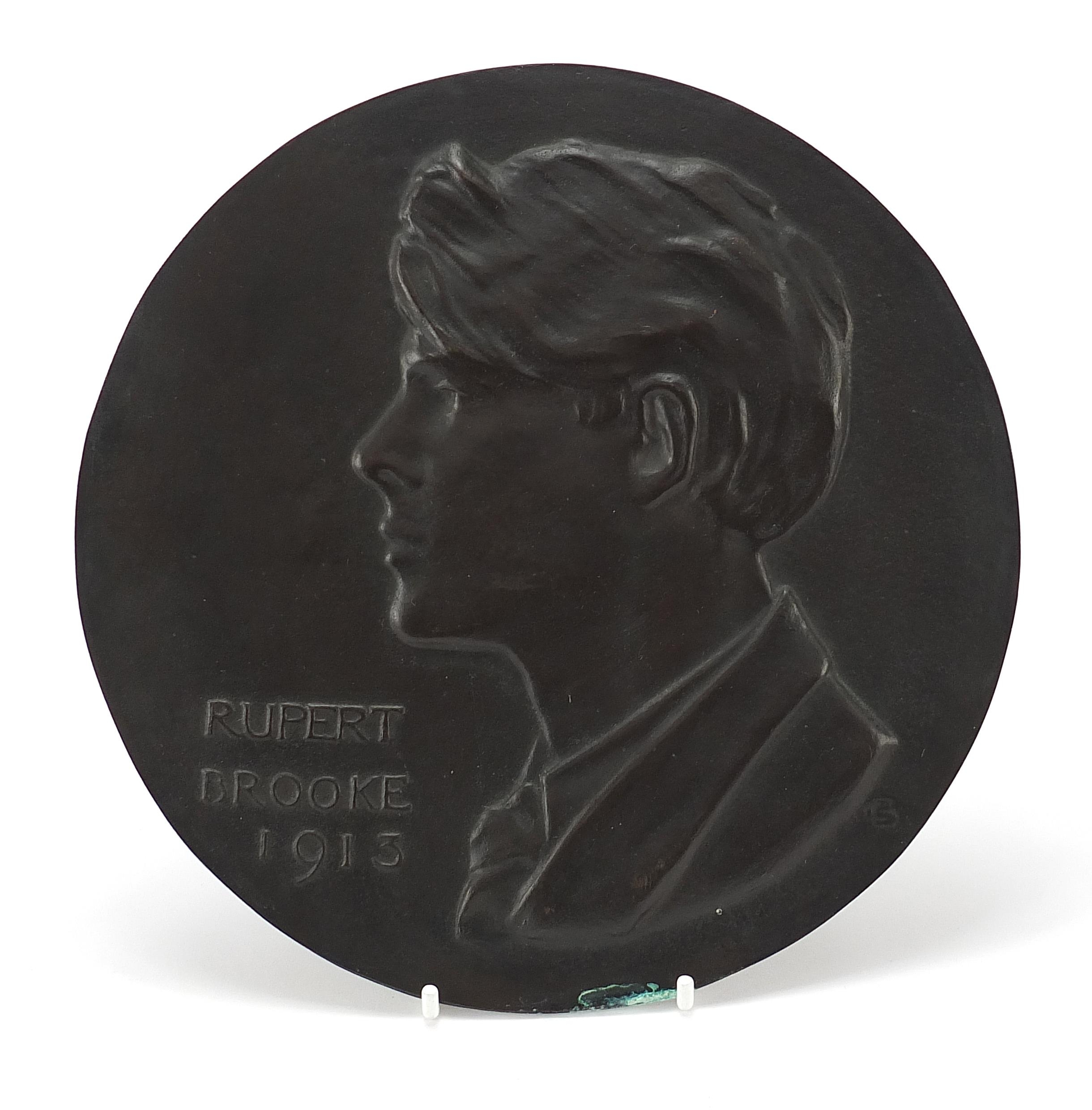 Circular bronze plaque with bust of Rupert Brooke dated 1913, 21.5cm in diameter