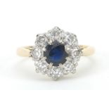 18ct gold sapphire and diamond flower head ring, the diamonds approximately 2.5mm in diameter,