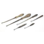 Edwardian and later silver handled buttonhooks including a folding example, various hallmarks, the