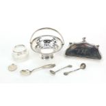 Silver objects including a concertina purse, pierced bonbon dish with swing handle and tennis medal,