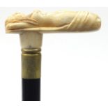 Hardwood walking stick with carved bone nude female handle, 90cm in length