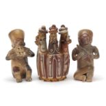 Pottery figures, possibly Peruvian to include two seated figures playing musical instruments and a