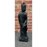 Large Chinese carved green/black stone figure of a standing figure holding a scroll, 69cm high