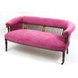 Edwardian inlaid rosewood two seater settee with pink upholstery, 68cm H x 142cm W x 72cm D