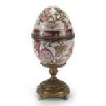 Ceramic egg trinket on a brass stand hand painted with flowers, 26cm high