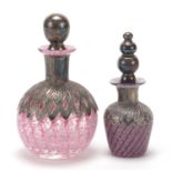 Two silver overlaid pink and purple glass scent bottles, indistinct hallmarks, the largest 12.5cm