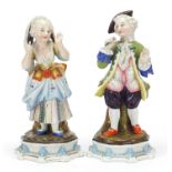 Pair of 19th century continental porcelain figurines, 25cm high