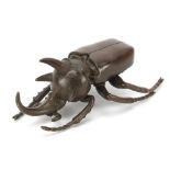Large Japanese patinated bronze rhinoceros beetle with articulated wings, impressed marks, 10.5cm in