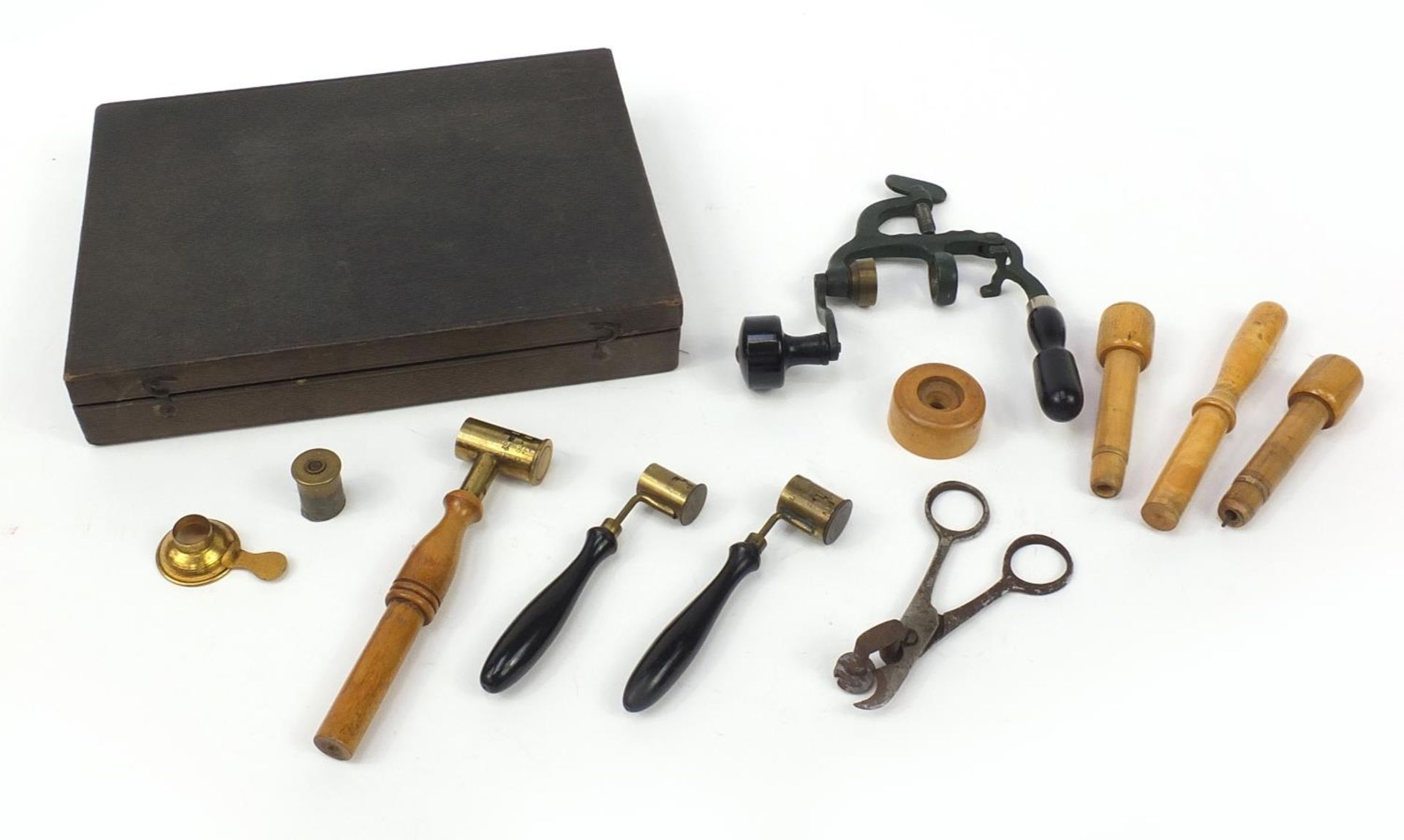 Antique gun ammunition making equipment including a cartridge maker, clamps and scissors housed in a
