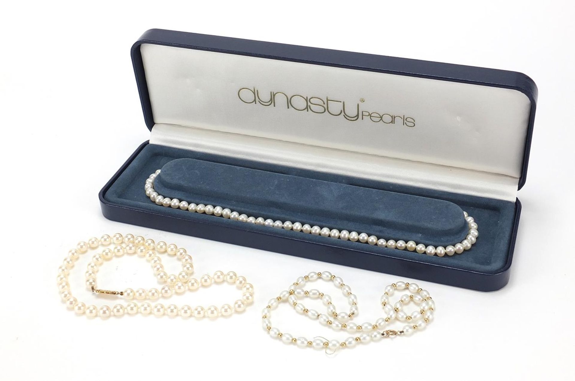 Three cultured pearl necklaces with 9ct gold clasps, the largest 44cm in length, total 51.5g