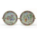 Pair of Chinese Canton porcelain warming plates hand painted in the famille rose palette with