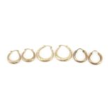 Three pairs of 9ct gold hoop earrings, the largest 2cm in diameter, total 3.2g