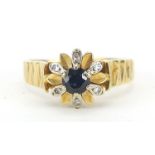 18ct gold sapphire and diamond flower head ring, engraved Srarlight, size P, 5.0g