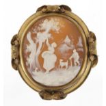 Large revolving cameo mourning brooch depicting a female picking apples, with gilt metal mount,