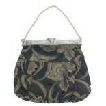 Vintage part silk ladies bag with silver coloured mount embossed with figures and windmills,
