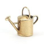 9ct gold watering can charm, 1.5cm wide, 0.6g