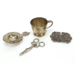 Sterling silver cup, naturalistic silver straining spoon and a white metal two piece buckle and