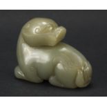 Chinese celadon and russet jade carving of a mythical animal, 6cm in length