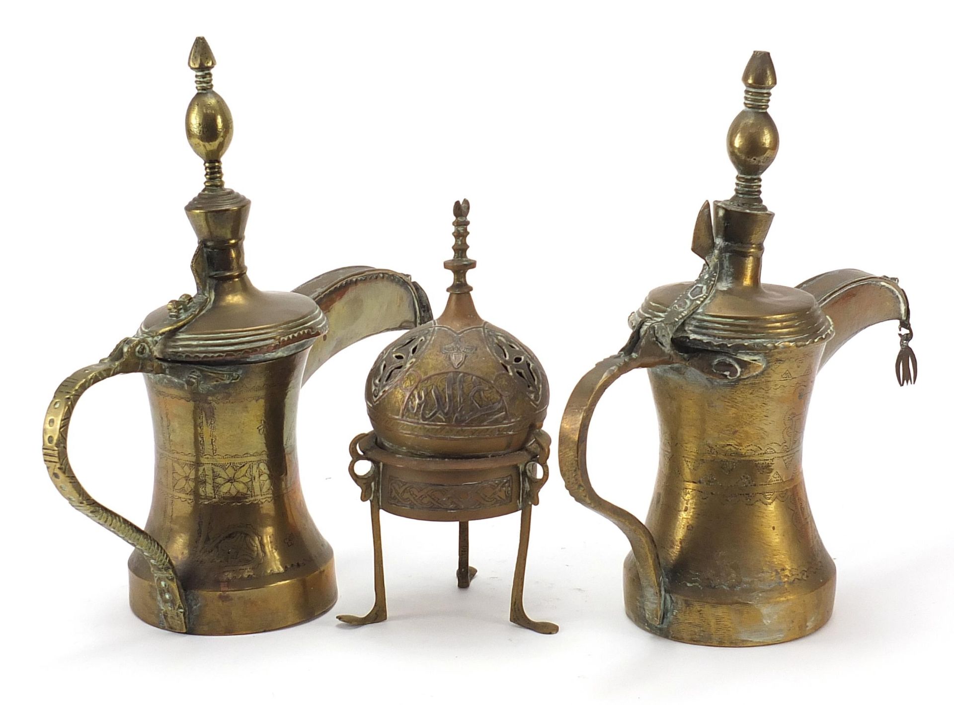 Middle Eastern metalware comprising two Omani Dallah coffee pots and a Cairoware incense burner with - Image 2 of 4