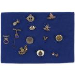 Thirteen military interest naval and regimental brooches, some silver, including South African Heavy