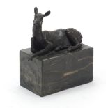 Mid century design patinated bronze sculpture of a recumbent deer raised on a black marble base,