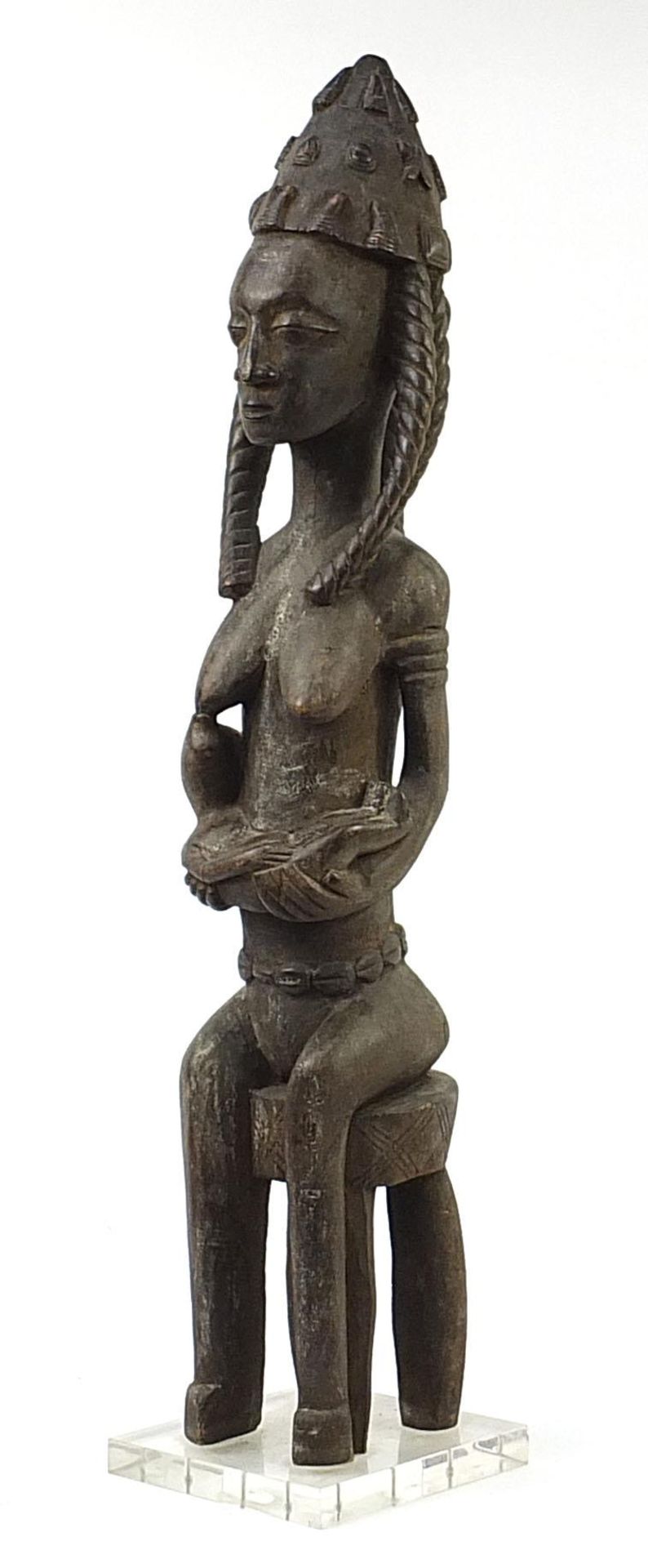 Large African Tribal interest carving of a nude tribeswoman feeding, probably from Western Sudan,