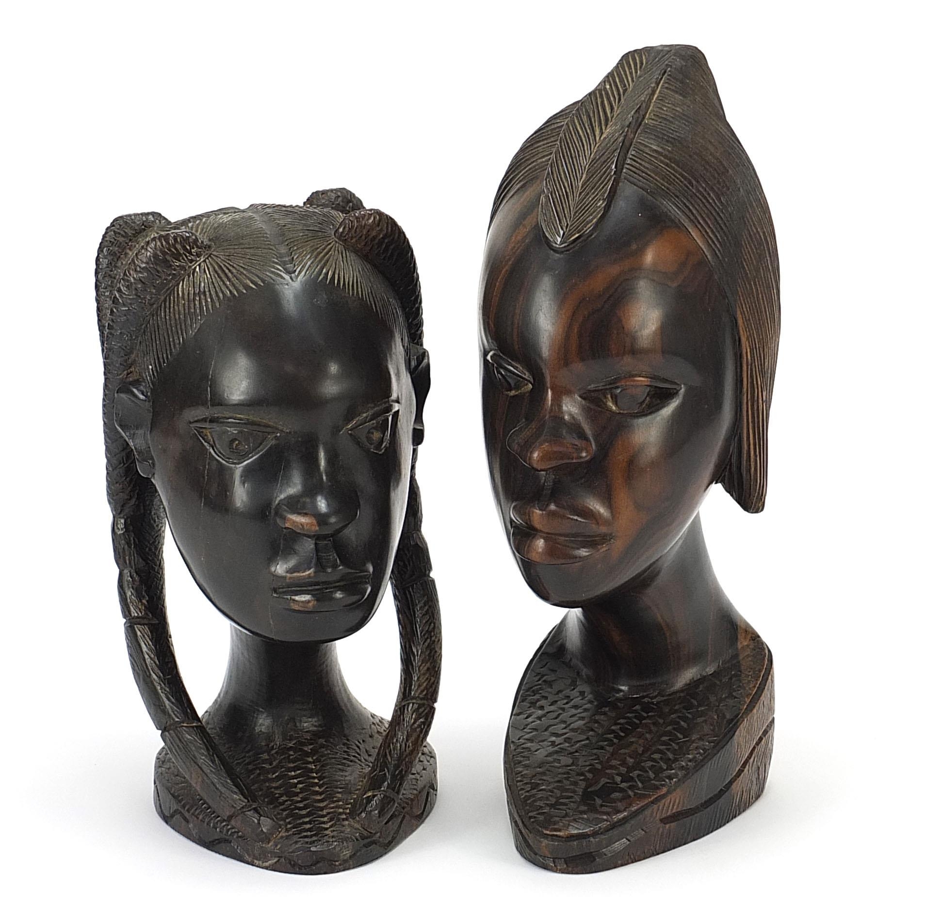Pair of African carved hardwood busts of tribeswomen, the largest 32cm high