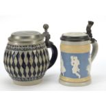 Two German pottery steins including one by Villeroy & Boch, decorated in relief with classical