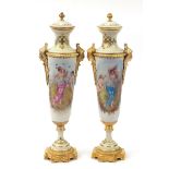 Large pair of French porcelain vases and covers with gilt bronze mounts in the style of Sevres, each