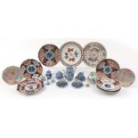 Japanese and Chinese ceramics including Imari plates, blue and white prunus jar with cover, snuff