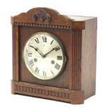 Oak striking mantle clock with Hao label to the interior, 27cm high