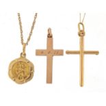9ct gold jewellery comprising two cross pendants, St Christopher pendant and two necklaces, 5.0g