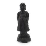 Chinese patinated bronze figure of a standing monk, 24.5cm high