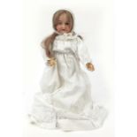 German bisque headed doll with jointed limbs, 62cm in length