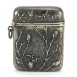 German silver vesta embossed with a spider and insects in a web, 4.5cm high, 15.0g