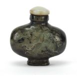 Chinese jade snuff bottle carved with a dragon in a mountainous landscape and calligraphy, 6cm high