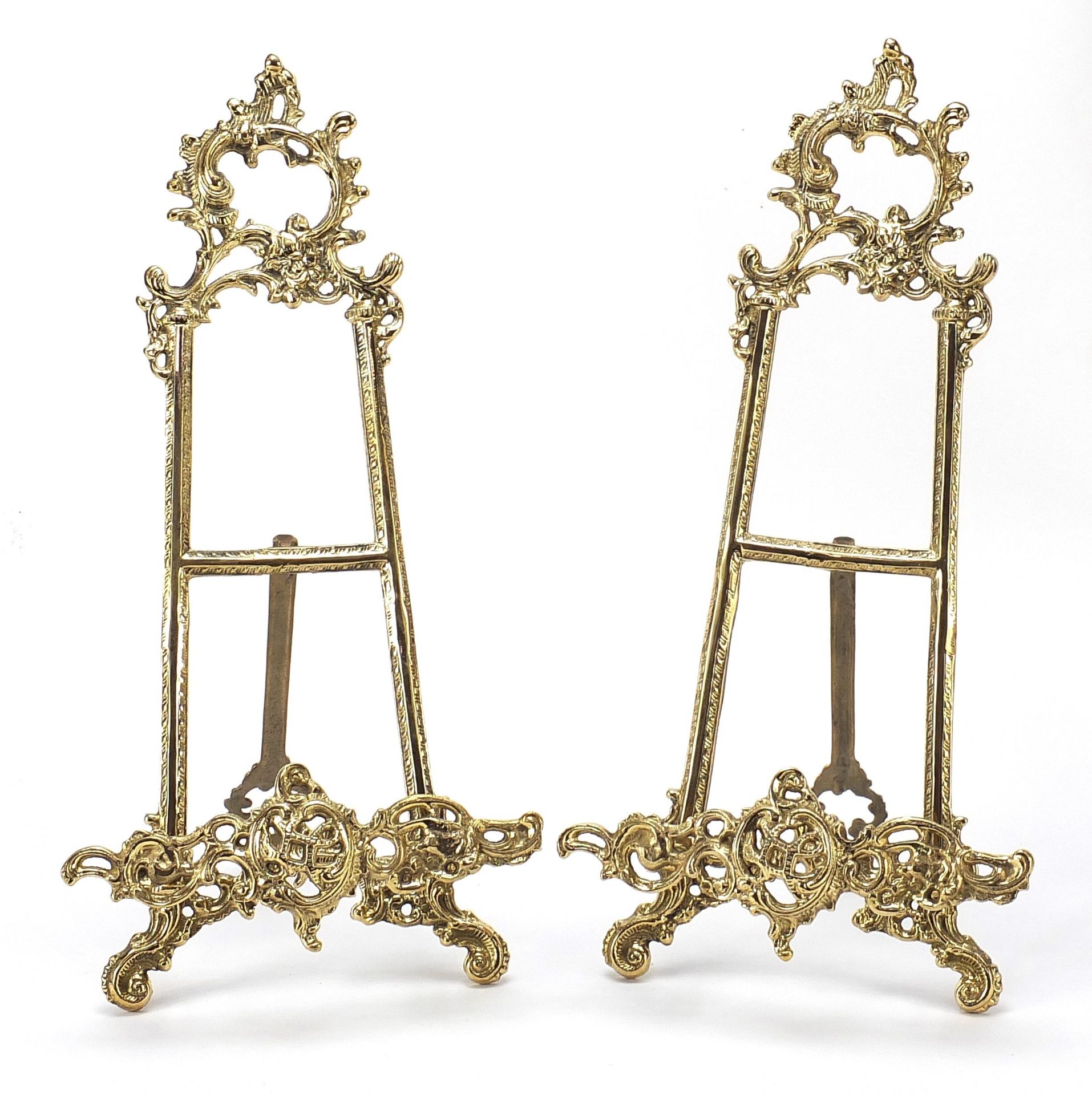 Pair of Rococo style brass easel stands, 38cm high