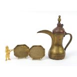 Middle Eastern metalware including an Omani coffee pot and a Benin style figure, the largest 28cm