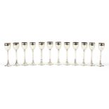 Set of twelve Austro Hungarian early 20th century silver liqueur glasses, 12cm hhigh, total 645.0g