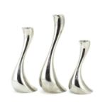 Georg Jensen, graduated set of three Danish candlesticks, the largest 24.5cm high