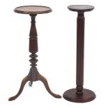 Two mahogany torcheres including one with a tripod base, the largest 69cm high