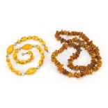 Two Baltic amber coloured necklaces, the largest 68cm in length, total 99.0g