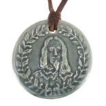 Portrait of Charles I pendant on a leather strap, 'For God and the King', 4.5cm in diameter