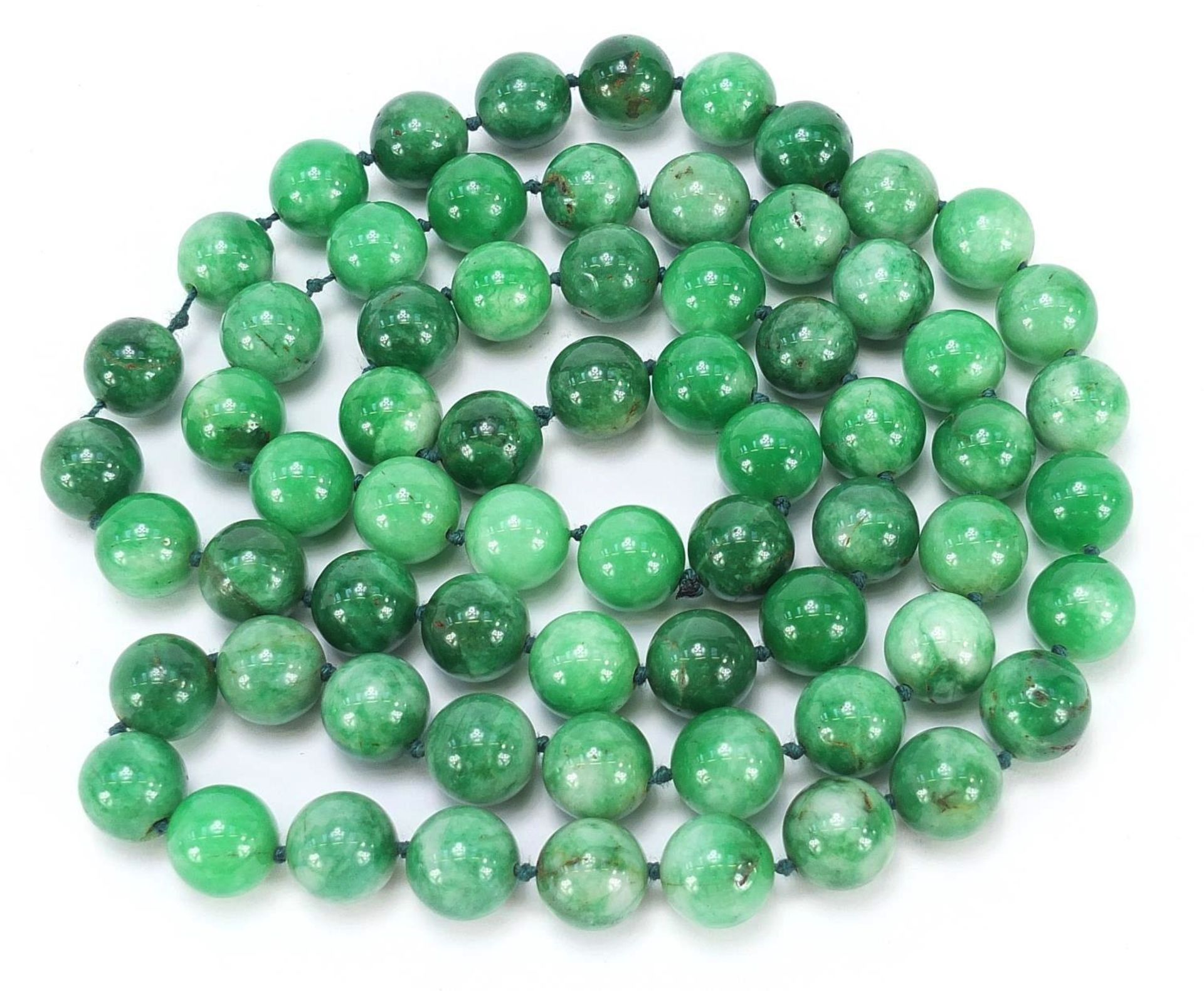 Chinese green hardstone bead necklace, possibly jade, each bead approximately 1.5cm in diameter,