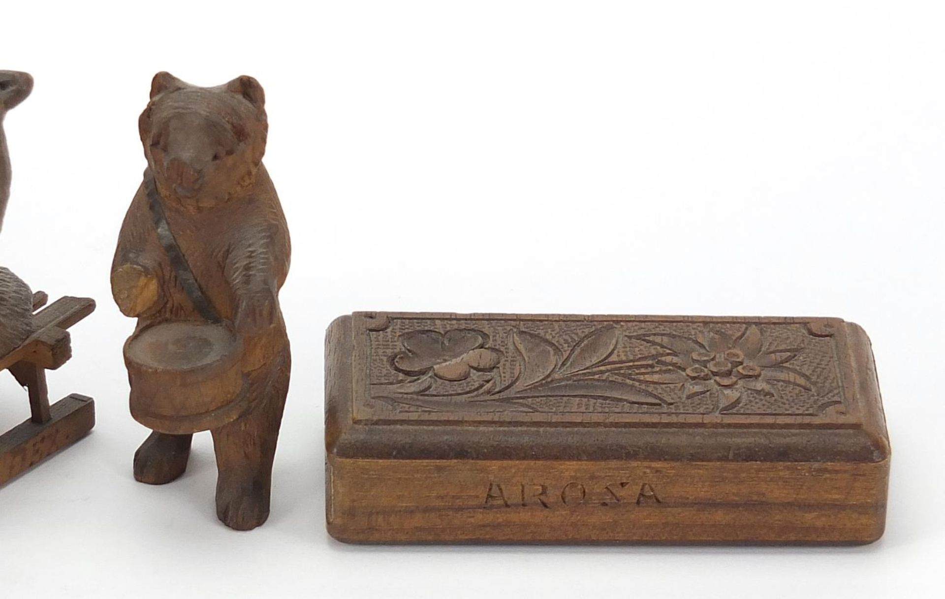 Three carved Black Forest bears and a matchbox including two riding sleds, the largest 15cm in - Image 3 of 5